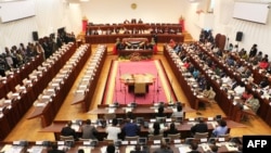 FILE - Members of the Mozambican assembly gather in Maputo, Jan. 12, 2015. The parliament passed a new anti-terror law on May 19, 2022, that some fear could be used to crack down on media.