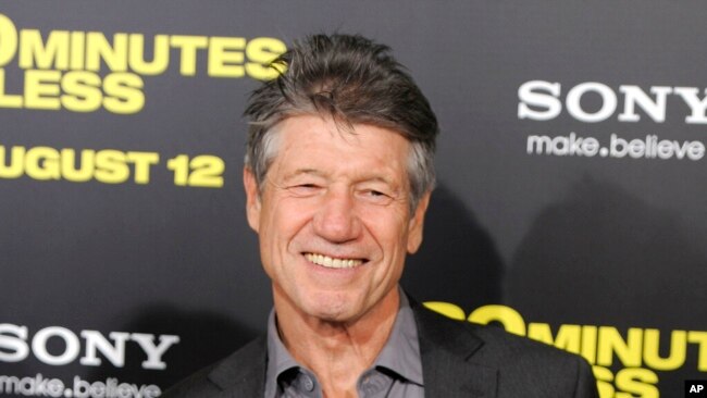 FILE - Fred Ward, a cast member in '30 Minutes or Less,' poses at the premiere of the film in Los Angeles on Aug. 8, 2011.