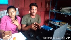 Kwazady Xipaia Mendes and Juma Xipaia participate in an online meeting with the Federal Prosecutors' Office in Para state, Brazil, March 15, 2022. (Warawara Xipaya dos Santos/Indigenous Association Pyjahyry xipaya Aldeia tukamã via AP)