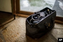 The doctor's bag of Doug Lambrecht sits in the house of his son, Nathan Lambrecht, in Woodinville, Wash., March 21, 2022.