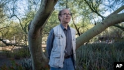 Physicist Frank Wilczek stands for a portrait at Arizona State University in Tempe, Ariz., on March 17, 2022. (Michael Clark via AP)