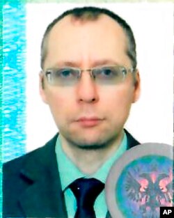An undated image taken with permission from the passport photo page of Russian diplomat Boris Bondarev.