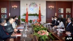 Tongan Prime Minister Huakavameiliku (2nd L) and visiting Chinese Foreign Minister Wang Yi (R) hold a meeting at the Prime Minister's Office in Nukualofa on May 31, 2022.