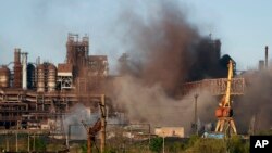 Smoke rises from the Metallurgical Combine Azovstal in Mariupol during shelling, in Mariupol, in eastern Ukraine, May 7, 2022.