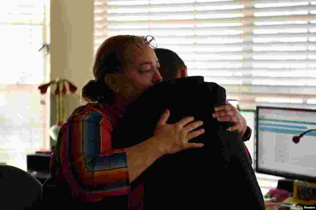 Margaret Garza hugs her son Julius Garza, 14, in Converse, Texas, March 22, 2022. Susan Hillis, the lead author of the first major modeling study to determine the numbers of children who lost a parent or caregiver to COVID, published last October in the journal for the American Academy of Pediatrics, said that it is crucial that hospitals, schools and churches work together to identify families who lost a caregiver so that children can be protected from neglect and other threats. While many look forward to the end of the pandemic, families such as Aidan and Julius's show its profound and enduring impact. "Our 'normal' is not going to be like anyone else's, because we lost someone," said Margaret Garza, Aidan and Julius's mother. 
