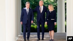 President Joe Biden accompanied by Swedish Prime Minister Magdalena Andersson and Finnish President Sauli Niinisto, walks out to speak in the Rose Garden of the White House , May 19, 2022.