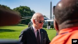 President Joe Biden speaks to members of the media on the South Lawn of the White House in Washington, May 30, 2022, after returning from Wilmington, Del. 