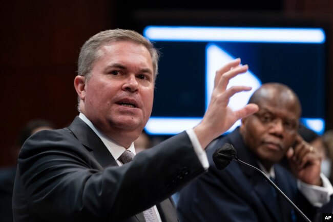 Deputy Director of Naval Intelligence Scott Bray, left, and Under Secretary of Defense for Intelligence and Security Ronald Moultrie.