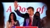 Mehmet Oz, a Republican candidate for US Senate in Pennsylvania, right, waves in front of his wife, Lisa, while speaking at a primary night election gathering in Newtown, Pa., May 17, 2022. 