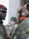 FILE - Guinea junta leader Col. Mamady Doumbouya, leaves a meeting with an ECOWAS delegation in Conakry, Guinea, Sept. 10, 2021. Authorities recently dissolved dozens of political parties.