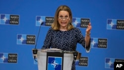 FILE - United States Ambassador to NATO Julianne Smith speaks during a media conference at NATO headquarters in Brussels, Tuesday, Feb. 15, 2022. 