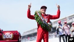Marcus Ericsson, of Sweden, celebrates after winning the Indianapolis 500 race at Indianapolis Motor Speedway in Indianapolis, Indiana, May 29, 2022.