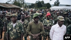 FILE: Militiamen of the armed group URDPC/CODECO from the Lendu community take part in a meeting with former warlords - from the 1999-2003 Ituri War - in the village of Wadda, Ituri Province, northeastern Democratic Republic of Congo on September 19, 2020. 