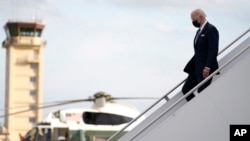 U.S. President Joe Biden disembarks from Air Force One on his arrival at Yokota Air Base, in Fussa, on the outskirt of Tokyo, Japan, May 22, 2022.