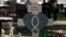 Messages are written on a cross honoring Irma Garcia, a teacher who was killed in the May 24 elementary school shooting in Uvalde, Texas, in this photo taken on May 26, 2022.