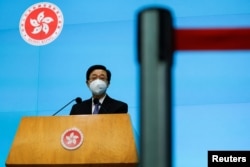 FILE - Hong Kong Chief Executive-elect John Lee speaks during a news conference, in Hong Kong, China, May 9, 2022.