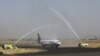 A Yemen Airways plane is greeted with water canon salute at Sanaa Airport as the first commercial flight in around six years, in Sanaa, Yemen, May 16, 2022.