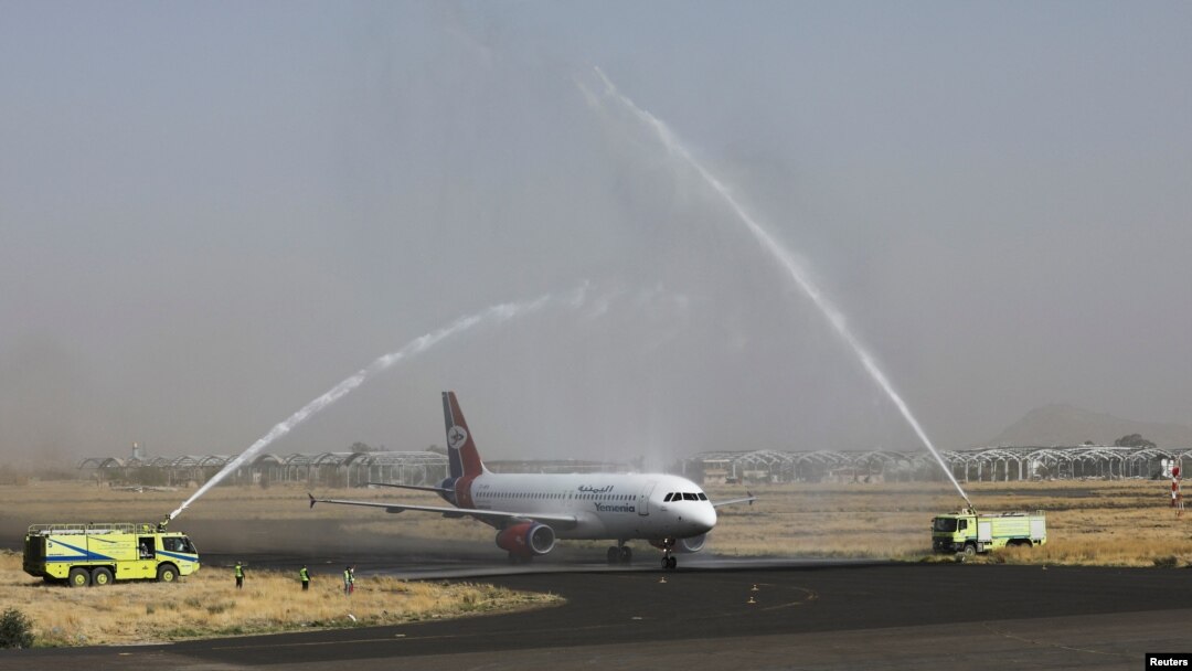 A Yemen Airways plane is greeted with water canon salute at Sanaa Airport as the first commercial flight in around six years, in Sanaa, Yemen, May 16, 2022.