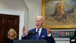 President Joe Biden speaks about the mass shooting at Robb Elementary School in Uvalde, Texas, from the White House, in Washington, as first lady Jill Biden listens, May 24, 2022.