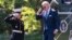 President Joe Biden returns a salute as he arrives at the White House from a weekend trip to his Delaware home, May 9, 2022, in Washington.