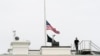 An American flag flies at half-staff at the White House, May 24, 2022, in Washington, to honor the victims of the mass shooting at Robb Elementary School in Uvalde, Texas.