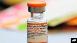 FILE - A vial of the Pfizer-BioNTech COVID-19 vaccine for children 5 to 12 years old sits ready for use at a vaccination site in Fort Worth, Texas, Nov. 11, 2021. Kids ages 5 to 11 should get a booster dose of Pfizer’s COVID-19 vaccine, advisers to the U.