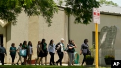 Guests arrive to the funeral service for Amerie Jo Garza at Sacred Heart Catholic Church, Tuesday, May 31, 2022, in Uvalde, Texas.
