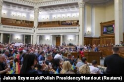 Poland's President Andrzej Duda addresses lawmakers as he became the first foreign leader to give a speech in person to the Ukrainian parliament since Russia's February 24 invasion, in Kyiv, Ukraine, May 22, 2022.