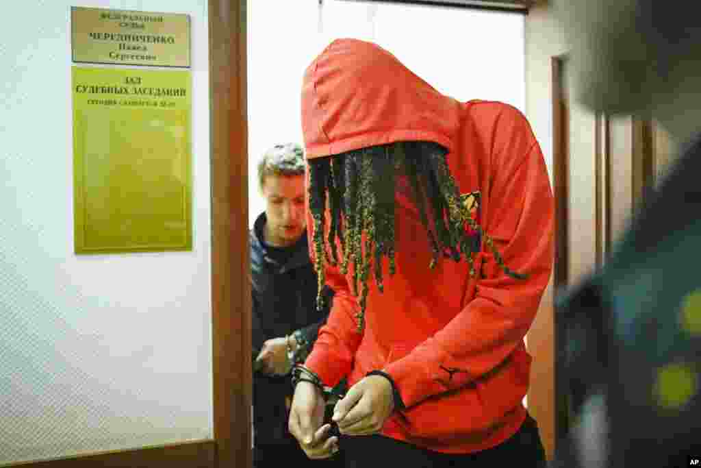 WNBA star and two-time Olympic gold medalist Brittney Griner leaves a courtroom after a hearing, in Khimki just outside Moscow, Russia. Griner was detained at the Moscow airport in February after vape containes with oil derived from cannabis were reportedly found in her bags, which could carry a maximum punishment of 10 years in prison.&nbsp;