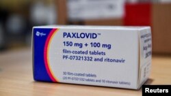 FILE: A box of Pfizer's COVID-19 treatment pill, named Paxlovid, at Misericordia hospital in Grosseto, Italy. 2.8.2022