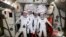 European Space Agency astronaut Matthias Maurer and NASA astronauts Tom Marshburn, Raja Chari and Kayla Barron pose for a photo in their spacesuits aboard the International Space Station's Harmony module on April 21, 2022. (NASA via AP)