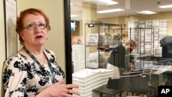 Clackamas County Elections Clerk Sherry Hall speaks at the office, May 19, 2022, in Oregon City, Ore. Ballots with blurry barcodes that can't be read by vote-counting machines will delay election results by weeks in a key U.S. House race in Oregon's primary.
