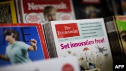 FILE - A copy of The Economist magazine is pictured at a news stand in central London, Britain, Aug. 12, 2015.