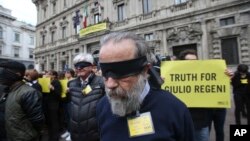 Amnesty International activists stage a flash mob asking for truth about the death of Italian student Guido Regeni, outside Milan's city hall, Italy, April 24, 2016. Egyptian officials have blamed five men for Giulio Regeni's death, but witnesses intervie