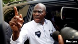 FILE - Martin Fayulu, runner-up in Democratic Republic of Congo's presidential election enters his car after delivering his appeal contesting the Congo's National Independent Electoral Commission results in Kinshasa, Democratic Republic of Congo, Jan. 12, 2019.