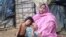 Noor Jahan and her daughter at an unidentified Rohingya village in Bangladesh, Dec. 28, 2016. (Saiful Islam for VOA)