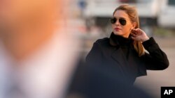 FILE - In this Sept. 12, 2020, photo, Counselor to the President Hope Hicks arrives with President Donald Trump at Reno-Tahoe International Airport in Reno, Nev.
