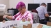 Staff work to 'cure' ballots, the process of contacting the voter to allow them to amend or correct issues with their ballot, for the midterm elections at the Maricopa County Tabulation and Election Center in Phoenix, Arizona, Nov. 13, 2022. 