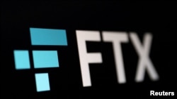 FILE - A photo illustration of the FTX logo, Nov. 8, 2022.