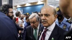 FILE: Pakistan's Prime Minister Shahbaz Sharif (C-R) escorts UN Secretary General Antonio Guterres (C-L) at the COP27 climate conference at Sharm el-Sheikh International Convention Centre in Egypt's Red Sea resort city of the same name on November 7, 2022.