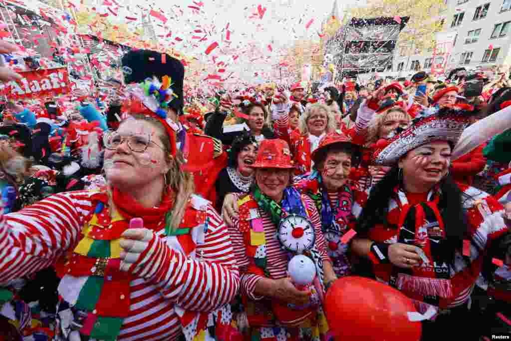 Revelers celebrate the start of the so-called "fifth," or foolish carnival season in Cologne, Germany.