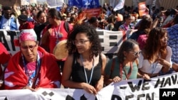 FILE: Egyptian Sanaa Seif (C)), the sister of imprisoned British-Egyptian activist Alaa Abdel Fattah, takes part in a protest staged by climate activists during the COP27 climate conference in Egypt's Sharm El Sheikh. Taken November 12, 2022