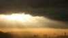 General view of the city during a sunset as smog covers Sarajevo, Bosnia, Nov. 14, 2022. 