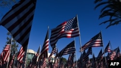 US flags are displayed in a Field of Honor ahead of the Veterans Day holiday outside of City Hall in Lawndale, California, November 9, 2022.