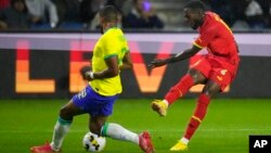 FILE - Ghana's Inaki Williams, right, attempts a shot at goal in front of Brazil's Gleison Bremer during the international friendly soccer match between Brazil and Ghana in Le Havre, western France, Friday, Sept. 23, 2022. 