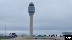 FILE - The air traffic control tower is seen at Hartsfield-Jackson Atlanta International Airport, in Atlanta, Georgia, Sept. 10, 2022.
