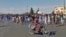 This image grab from a UGC video posted on Nov. 11, 2022, shows protesters holding signs and chanting slogans during a march in Khash, in Iran's southeastern province of Sistan-Baluchistan. (Photo by UGC /AFP)
