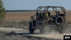 FILE —Israeli soldiers patrol near the border with the Gaza Strip in southern Israel on November 16, 2023, amid ongoing battles between Israel and the Palestinian militant group Hamas. 