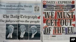 Some of the front pages of Britain's newspapers after the High Court determined that MPs must have a say on triggering Article 50 to begin the UK's exit from the European Union, in London, Nov. 4, 2016. 