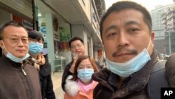 FILE - Ren Quanniu, right, and other supporters of lawyer Lu Siwei pose for a group photo in Chengdu in southwestern China's Sichuan Province, Jan. 13, 2021, in this photo taken by Ren Quanniu. 